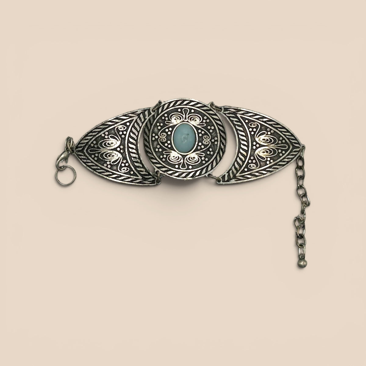 Broche ovale argenté cabochon turquoise